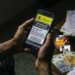 A conceptual image showing a smartphone with a fake appointment and Euro bills, representing the warning for immigrants in Spain against residency scams.