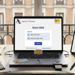 Official Renta Web portal on a laptop screen showing tax login options in Spain.
