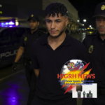 Mounir Meziat being escorted by Spanish National Police officers at an airport terminal following the suspension of his deportation.