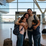 Family reunification in Spain with an immigrant family reuniting at a Spanish airport