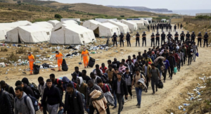 Migrants and police during the Loma Colmenar evacuation in Ceuta