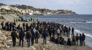 Migrants gathered on a beach in Ceuta during the migration crisis