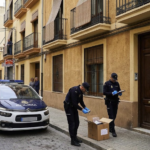 Spanish National Police officers during the arrest operation for a fugitive wanted in Germany in Valencia