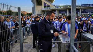 Security guard working at a football stadium entrance in Malaga