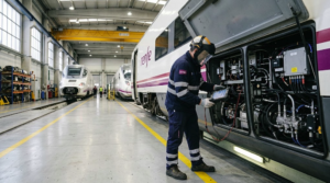 Railway maintenance worker inspecting a Renfe train in Spain