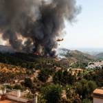 Benahavís wildfire with smoke rising over the hills in Málaga