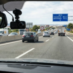 Dash cam installed inside a car while driving on a Spanish road