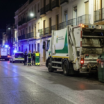Garbage collection truck beside waste containers in Cartagena after a fatal incident