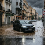 Vehicle driving through a flooded street after torrential rainfall