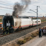 High-speed train with smoke and flames after a fire near Zaragoza, Spain.