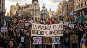 Protest banner in Spain reading 'Housing is a right, not a business' at a demonstration preceding Pedro Sánchez's early election call over the housing crisis.